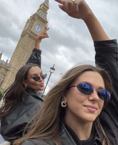 two women taking a selfie in front of the big ben clock tower