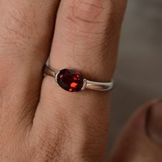 This is a gorgeous handmade creation. Its beauty is its simplicity & Elegance. The 6*8mm oval shape natural garnet (January birthstone) is crafted in solid sterling silver and with rhodium plated. All item is sent in a beautiful gift box You can realize more lovely stuff clicking the link https://www.etsy.com/shop/knightjewelry?refshopsection_shophome_leftnav Please leave the correct address and you phone number for delivering successfully. Oval Garnet Ruby Ring As Gift, Oval Garnet Birthstone Ring As Gift, Silver Oval Garnet Birthstone Ring, Oval Silver Garnet Birthstone Ring, Oval Garnet Birthstone Ring In Silver, Oval Garnet Birthstone Ring, Sterling Silver Ruby Ring With Polished Finish, Oval Ruby Ring With Polished Finish In Sterling Silver, January Birthstone Rings