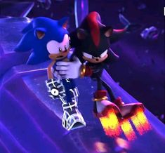 two sonic and tails characters standing next to each other