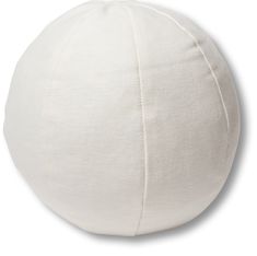 a white round pillow sitting on top of a table