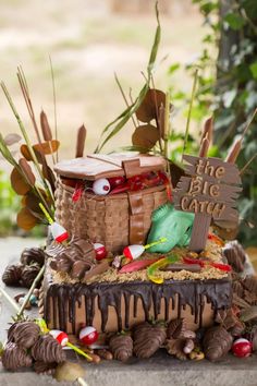 a cake with chocolate icing and candy on top that says, the tale came