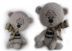 two crocheted teddy bears sitting next to each other