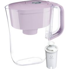 a water pitcher with a filter attached to the side and a cup next to it