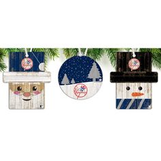 three wooden ornaments hanging from a christmas tree with the tampa rays logo on one ornament