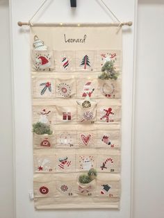 a wall hanging with christmas decorations on it