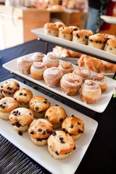 two trays filled with different types of pastries