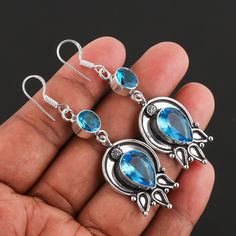 ".Blue Topaz Gemstone Earring 925 Sterling Silver Handmade Jewelry Earring gift for Women., Antique Silver Earring :Welcome To Store:- Metal             :-    Sterling Silver Total Weight  :-    8 Gram Over Main Stone    :-    Blue Topaz Stone Size     ;-     10/14 mm Pear, 8 mm Round Color              :-    Silver Type               :-    Earring's Metal Purity   :-    925 Theme:Angels, Beach, Beauty, Biker Occasion:Anniversary, Birthday, Christening, Christmas, Confirmation/Communion, Engagement, Father's Day, Graduation, Mother's Day, Valentine's Day                                                  -:Shipping Handling:- Handling Time:- We take handling time of 2 to 3 Business Day from the date of receipt of the payment after receiving cleared payment. Shipping Services:- We use Standar Silver Topaz Teardrop Earrings, Silver Teardrop Topaz Earrings, Silver Topaz Dangle Earrings, Blue Topaz Dangle Earrings For Gift, Topaz Dangle Earrings For Gift, Topaz Drop Earrings Gift, Topaz Drop Earrings For Gift, Antique Silver Earrings, Handmade Dangle Earrings