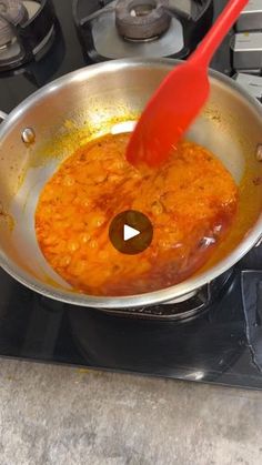 a frying pan filled with food on top of a stove