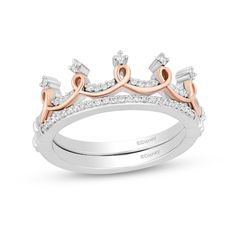 a white and rose gold crown ring with diamonds on the sides, set in two tone gold