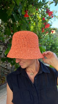 We present to you a crocheted raffia hat in peach color.   Why a bucket raffia hat?  Because it is an environmentally friendly material, the hat is lightweight, breathable, and can be folded into a bag and taken with you on a trip or vacation.  A hat can be a great gift for your loved ones. Hat weight is about 100 grams. You will feel comfortable on the beach and will provaid reliable protection from the sun. Hat size: for head circumference 55-56 cm, 21,6-22 inches. You an contact me to order t Orange Summer Hat For Beach Season, Orange Summer Straw Hat For The Beach, Summer Straw Bucket Hat For Spring, Orange Brimmed Straw Hat For Beach, Summer Orange Brimmed Straw Hat, Orange Summer Straw Hat For Vacation, Orange Brimmed Sun Hat For Vacation, Orange Bucket Hat For Summer, Orange Beach Hat