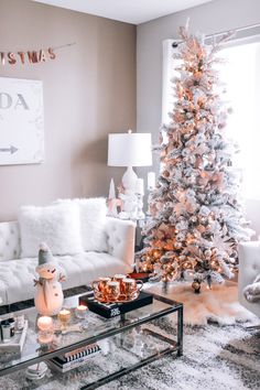 a living room with a white christmas tree