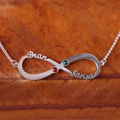 Please pay attention: Only the first letter of the engraving is capitalized! This shimmering Infinity Name Necklace is the perfect way to display your love wherever you go. Choose two names and two coordinating birthstones to make this piece personal just for you and your loved one. Anyone is sure to treasure this timeless silver piece.Chain Type: Width: 44 mmHeight: 14.5 mmThickness: 1.2 mmMaterial: Plating Color: Silver Elegant Silver Infinity Name Necklace, Infinity Shape Custom Name Necklace For Anniversary, Infinity Name Necklace For Anniversary Gift, Silver Infinity Name Necklace For Anniversary, Silver Infinity Name Necklace, Custom Name Infinity Necklace For Anniversary Gift, Custom Name Infinity Necklace For Anniversary, Personalized Infinity Engraved Jewelry, Custom Name Infinity Jewelry For Anniversary