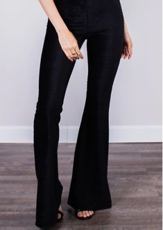 Fitted black high-rise corduroy pant with a bell bottom silhouette. Fits true to size. Flared Velvet Bottoms, Stretch Velvet Flare Bottoms, Fall Velvet Flare Bottoms, Black Full-length Flare Jeans For Night Out, Black Full Length Flare Jeans For Night Out, Stretch Flare Corduroy Bottoms, Stretch Corduroy Flare Bottoms, Black Velvet Bottoms For Night Out, Black Corduroy Bottoms For Fall