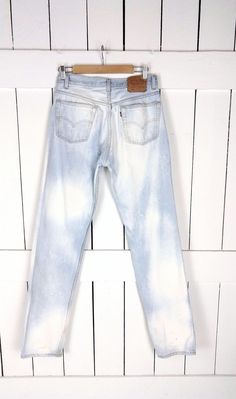 "501 bleached button fly denim jeans/vintage straight leg blue jeans/faded Levi Strauss jeans/30 x 34 Measurements...taken flat -across waist: 15\" -across hips: 20\" -inseam: 34\" -rise: 11\" -best fits: 30 x 34 -marked size: 33 x 36 Features... -classic pair of denim jeans -the perfect light blue wash...perfectly worn in and faded -bleached effect -straight leg -button fly -high waist style -100% cotton -label: Levis 501 -made in USA Condition: -great vintage condition -bleached effects throug Fitted Light Wash Bleached Jeans, Light Wash Bleached Fitted Jeans, White Bleached Straight Leg Bottoms, White Bleached Straight Leg Jeans, Fitted Straight Leg Bleached Jeans, Relaxed Fit Bleached Light Wash Jeans, Light Wash Relaxed Fit Bleached Jeans, Relaxed Fit Light Wash Bleached Jeans, Light Wash Bleached Relaxed Fit Jeans