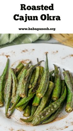 roasted cajun okra on a white plate with the title above it reads roasted cajun okra