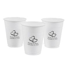 three white plastic cups with hearts on the side and names in black ink, set against a white background