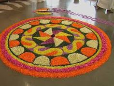 a circular flower arrangement on the floor at an airport