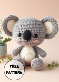 a crocheted koala bear sitting next to a potted plant with the caption free pattern