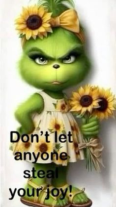 a green teddy bear with sunflowers on its head and the words, don't let anyone steal your joy