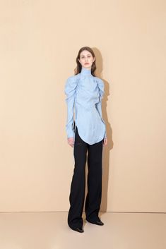 Incorporating a minimalism that celebrates sleek modern fashion into each collection; it's evident with this effortless blouse, that Aleksandre Akhalkatsishvili is trying to reimagine the way women dress. Cut into a relaxed silhouette, detailed with long ruched sleeves, a mock-collared neckline, and modernized with cut outs at the shoulders; perfect for any occasion. -- Product Details Composition: 100% Cupro Slim Fit Zip fastening at back Cut Out detailing at shoulders Long sleeves Unlined Leather Bralette, Knotted Blouse, Amazing Dresses, Faux Leather Pants, Women Dress, Modern Fashion, Global Fashion, Beautiful Outfits, Runway Fashion