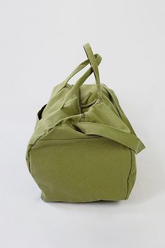 Nothing beats the simplicity and functionality of a good duffel bag—except maybe a Certified Organic Cotton duffel bag made with the good of the environment and people in mind! Durable and versatile, the Bumi Duffel Bag is sustainably and ethically made with 14-oz heavy duty Fairtrade organic cotton canvas. The perfect size for a spontaneous weekend getaway or when you need a little more room to haul daily needed gear for work or athletics, the Bumi Duffel has an adjustable shoulder strap, an outside drop-in pocket and an internal zippered pocket for keeping small items secure and accessible. Content + Care Made with 14-oz Certified Fairtrade Organic cotton canvas Approximately 56L capacity Two main compartment zippers with long pulls Internal zippered hanging pocket External drop-in pocke Practical Green Rectangular Travel Bag, Practical Tote Duffle Bag For Overnight Trips, Practical Weekender Bag For Weekend Trips, Green Practical Duffle Bag With Luggage Sleeve, Practical Green Rectangular Duffle Bag, Everyday Green Rectangular Gym Bag, Green Functional Weekender Bag For Daily Use, Versatile Green Canvas Travel Bag, Functional Green Weekender Bag For Daily Use