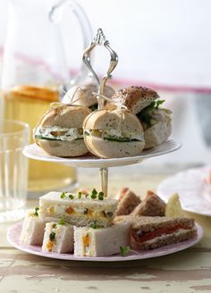 a table topped with plates and cups filled with desserts