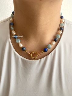 ✨Gold-Plated Necklace with Lapis Lazuli, Aquamarine, and Freshwater Pearls | 16.5 inches Add a touch of elegance to your style with this stunning **Gold-Plated Necklace** featuring a harmonious blend of **Lapis Lazuli **Aquamarine and **Freshwater Pearls**. Designed to be versatile, this piece transitions effortlessly from daily wear to special occasions. ✨ **Materials & Design   Crafted from high-quality gold-plated materials, this necklace offers a luxurious and durable finish. The combination of **Lapis Lazuli** and **Aquamarine** creates a striking harmony of blue tones, while the **Freshwater Pearls** add a timeless and elegant touch. 💙 **Elegant Blue Tones   The deep blue of **Lapis Lazuli** complements the soft, serene hues of **Aquamarine creating a perfect balance of color. Toget Blue Gemstone Pearl Necklace, Blue Pearl Jewelry For Jewelry Making, Blue Pearl Necklaces With Gemstone Beads, Blue Pearl Necklace With Natural Stones, Handmade Blue Pearl Necklace For Gift, Handmade Blue Pearl Necklace Gift, Blue Round Jewelry With Pearl Charm, Blue Round Pearl Charm Jewelry, Blue Pearl Necklace With Natural Stones For Gift