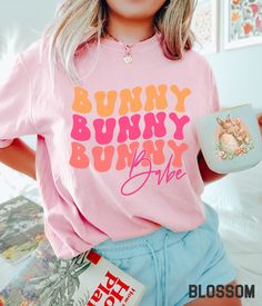 Super cute Easter Graphic Tee. This oversized t-shirt is available in a variety of vibrant colors and includes a playful neon bunny babe design. You'll love the comfortable material of the Comfort Colors fabric. It ensures a soft and comfortable feel that will keep you feeling good all day long. This womens Easter tshirt will have you standing out while you celebrate the holiday. 🐇🐣 Bunny Babe Tshirt, Retro Bunny Babe Shirt, Comfort Colors Bunny Babe Tee, Neon Easter Shirt, Wife Easter Gift, O Hibiscus Shirt, Casual Cottagecore, Babe Shirt, Easter Tees, Kawaii Shirts, Easter Bunny Shirts, Cat Lover Shirt, Bunny Shirt, Fabric Set