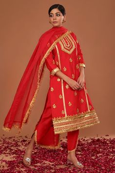 Red dupion long kurta with gota embroidery. Comes with tapered side-cut pant and an organza dupatta. - Aza Fashions Red Salwar Kameez With Gota Work For Celebration, Red Chanderi Traditional Wear With Gota Work, Red Traditional Chanderi Wear With Gota Work, Red Traditional Wear In Chanderi With Gota Work, Red Salwar Kameez With Zari Work For Celebration, Red Cotton Silk Kurta For Festivals, Red Semi-stitched Kurta For Celebration, Red Kurta With Dupatta For Celebration, Red Art Silk Salwar Kameez For Celebration