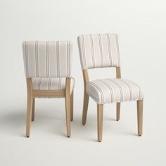 two chairs with striped upholstered back and arms, one in white and the other in beige