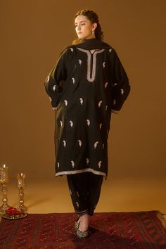 Black pheran kurta with kashmiri tilla hand embroidery in paisley pattern. Paired with a coordinating salwar and a sheer dupatta. - Aza Fashions Embroidered Chanderi Fabric For Straight Kurta With Dabka, Embroidered Dabka Fabric For Traditional Ceremonies, Traditional Cambric Kurta With Zari Work, Unstitched Jamawar Suit With Embroidered Border, Embroidered Jamawar Lawn Suit Straight Kurta, Traditional Embroidered Fabric For Straight Kurta With Dabka, Anarkali Lawn Suit With Embroidered Border Jamawar, Anarkali Jamawar Lawn Suit With Embroidered Border, Eid Jamawar Lawn Suit With Embroidered Border