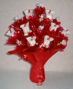 a bouquet of candy wrapped in red and white