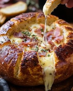 Indulge in a rich, savory Garlic Prosciutto and Hot Honey Baked Brie Bread Bowl, perfect for cozy gatherings and gourmet appetizers. Baked Brie Bread Bowl, Baked Brie Bread, Honey Baked Brie, Brie Bread Bowl, Baked Brie Honey, Honey Appetizers, Brie Bread, Winter Appetizers, Spinach Bread