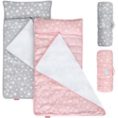 a pink and grey bedding set with stars on it