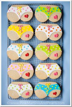 decorated cookies are arranged on a cooling rack for the kids to use in their swimsuits