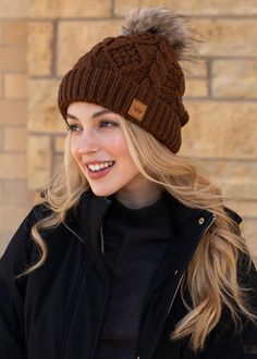 Warehouse Sale Special!  The perfect winter hat to go with all of your looks! Our brown cable knit pom hat is fleece lined, and features a trendy natural faux fur pom accent. Brown cable knit hat Natural faux fur pom accent Fleece lined Crown patch on the left side One size Designed in the U.S.A. Produced in China.  100% Acrylic *This item is a sale item and is final sale. It will not be eligible for returns or exchanges. Cute Beanies, Cable Knit Hat, Cap Patterns, Crochet Cap, Winter Cap, Cap Fashion, Knit Mittens, Pom Pom Hat, Pom Beanie