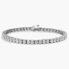 Finish your look with classic elegance with this stunning tennis bracelet crafted beautifully from lustrous 14k white gold. It flaunts 10 ct. tw. in brilliantly shimmering oval-cut diamonds encircling it. Diamond Tennis Bracelet, Tennis Bracelet Diamond, Oval Cut Diamond, Blue Nile, Bracelet Crafts, Oval Diamond, Tennis Bracelet, Classic Elegance, Oval Cut