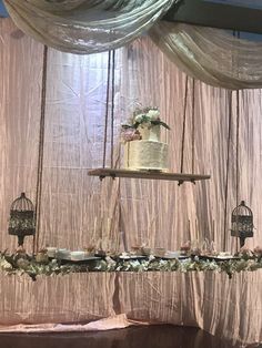 a wedding cake is hanging from the ceiling