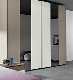 an empty bedroom with sliding doors in it