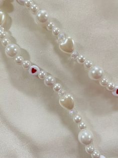 Lots of Love Pearl Phone Charm Strap - Etsy Singapore Valentine's Day White Beaded Necklaces, White Beaded Necklaces For Valentine's Day, Handmade White Beaded Necklaces For Valentine's Day, Handmade White Beaded Necklace For Valentine's Day, White Adjustable Necklace For Valentine's Day, Adjustable White Necklace For Valentine's Day, Adjustable White Necklace With Heart Charm, Valentine's Day Pearl Heart Beaded Necklaces, Valentine's Day Pearl Beaded Necklaces With Heart Beads