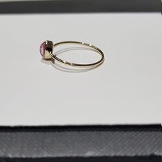 14k solid yellow gold natural oval shaped cabochon tourmaline semi precious gemstone ring. 1. The weight of the natural tourmaline gemstone used in the ring =0.65 cts. 2. The weight of the 14k solid yellow gold used in the ring =0.860 grms. The ring is very nice and beautiful. Thanks Oval Ruby Ring Stackable For Formal Occasions, Dainty Oval Cabochon Ring, Tourmaline Ring With Bezel Setting In Oval Cabochon, Tourmaline Bezel Set Ring In Oval Cabochon, Tourmaline Bezel-set Oval Cabochon Ring, Adjustable 14k Gold Oval Opal Ring, Adjustable Oval Opal Ring In 14k Gold, Oval Tourmaline Sapphire Ring For Gifts, Adjustable 14k Gold Opal Ring