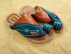 Use code COMBINEDSHIPPING and get $50 off your second pair. Check out all men's leather sandals: https://www.etsy.com/shop/sandcruisers/?section_id=25459641 You will love these traditional Arabian sandals. The straps and soles are made of leather. The leather lining will feel so soft and comfortable against your foot. They are designed to fit your foot loosely with lots of room in the toe-ring and straps. The leather sole will mold and shape to your foot over time, even creating an arch against Traditional Blue Sandals For Summer, Traditional Blue Sandals For Festival, Traditional Blue Sandals For Beach, Summer Leather Sandals, Mens Shoes Sandals, Leather Sandals Handmade, Mens Leather Sandals, Brown Leather Sandals, Retro Summer