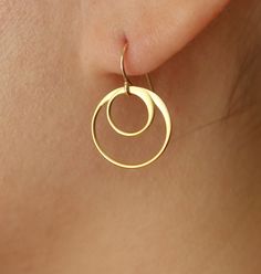 Simple and beautiful, the circle is thin and round on one side and more full and flat on the other which creates just a little bit of playfulness, a little bit of difference to catch the eye. Perfect. Simple yet rich. These earrings come in a variety of combinations of both sizes, and material - order a pair in all silver, all 24K gold plate over sterling silver, or mix the two for the perfect pair of two-tone earrings. The ear wires will be in either sterling silver or gold filled, depending on Wedding Earrings Gold, Gold Circle Earrings, Circle Charm Necklace, Bridesmaids Earrings, Gold Earrings Wedding, Dangle Earrings Gold, Circle Pendant Necklace, Gold Circle, Earrings Hoop