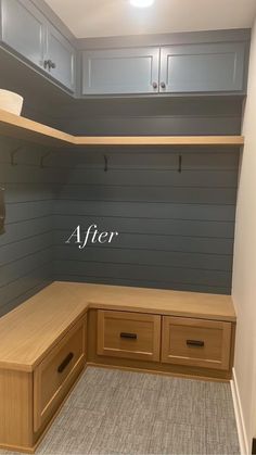 an empty walk - in closet is shown with the word after painted on it's wall