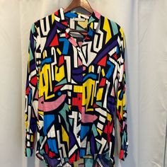 Never Worn, Beautiful Condition. Would Pair Well With A Blazer Trendy Multicolor Shirt With Vibrant Print, Chic Multicolor Abstract Print Blouse, Chic Multicolor Printed Blouse, Chic Multicolor Blouse For Day Out, Trendy Multicolor Blouse With Graphic Print, Trendy Multicolor Patterned Shirt, Trendy Colorful Patterned Shirt, Bold Multicolor Printed Tops, Multicolor Vibrant Print Shirt For Fall