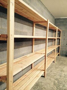 several wooden shelves lined up against a wall