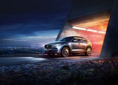 the new mazda cx - 5 is shown at night