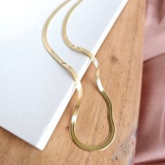 Introducing our all-new Luxe Gold Delicate Herringbone Chain – your stylish sidekick for every occasion! Whether you're rocking your favorite jeans and tee combo or glamming up for a night out, this chain has got your back. Versatility is the name of the game here. Whether you're a fan of minimalism or love a layered look, this necklace is your ultimate styling canvas. * 18k gold-plated stainless steel * Hypoallergenic * Tarnish resistant * Waterproof PVD Coating * Durability * Longer lifetime * Curvy Girl Dress, Pvd Coating, Herringbone Chain, Got Your Back, Graphic Tops, Layered Look, Your Back, Men's Collection, Love A