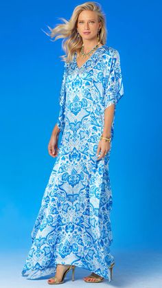 Blue Silk Kaftan For Vacation, Blue Printed Kaftan With Kimono Sleeves, White Silk Kaftan With Floral Print, Elegant Blue Floral Print Kaftan, Blue Silk Kaftan For Spring, Spring Blue Silk Kaftan, Elegant White Printed Kaftan, Elegant Blue Silk Kaftan, Blue Silk V-neck Kaftan