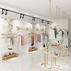 the interior of a clothing store with clothes on racks